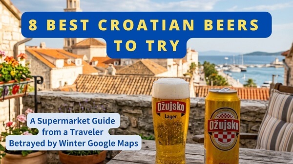 A tall glass of frothy golden beer sits on a rustic wooden table with an open Ožujsko can on a Split patio overlooking the Old Town rooftops and Bell Tower of Saint Domnius.